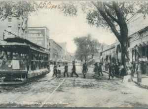 Divided back postcard of a Lowell-bound streetcar on Essex Street at Broadway in Lawrence, postmarked 1906