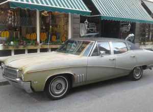 Rusty bronze 1969 Buick Skylark Custom 4-Door Sedan parked on Langdon Street in downtown Montpelier, Vermont.