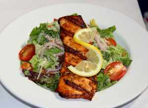 Perfectly grilled salmon filet, cut fresh daily and dipped in Elaine’s Marinade, served on Classic Caesar salad
The LEMON LEAF Cafe
Historic Down Town Lancaster
653 W. Lancaster Boulevard
Lancaster, CA 93534
&lt;a href="http://www.lemonleaf.com"