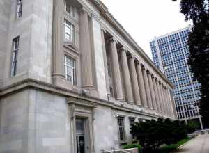 Looking southwest from Franklin Street along colonnade of en:United States District Court for the District of New Jersey and Post Office in Newark on a mostly sunny midday.