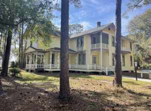 This impressive home is part of Pinellas County's history. It is a historic home that features a classic Queen Anne style through its asymmetrical shape, wings, and gables facing in multiple directions. The home was originally built in 1907 and moved