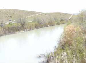  Jordan River in  Midvale.  Trail is on the right (east) side of the River.  Capped tailings from the Sharon Steel  Superfund site is also on the right.
