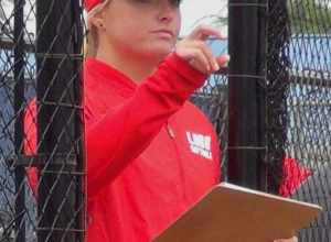University of New Mexico pitching coach Megan Betsa coaches her team during a game at San Jose State University on April 29, 2018.