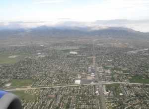 The Utah Olympic Oval, an indoor speed skating oval built for the 2002 Winter Olympics, is located 14 miles (23 km) southwest of Salt Lake City, in Kearns, Utah. The Oval hosted the long track speed skating events for the 2002 games. Inside the