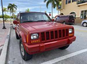 Jeep Cherokee XJ (1997–2001) 4-door. Front view. This SUV repainted all red. Photographed in Florida.