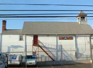 Looking north at Hook and Ladder Company 1 firehouse at Hawthorne and Corona Streets in eastern en:Valley Stream, New York on a sunny late afternoon.