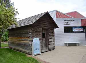 The old Washington County Jail, a log building that was in use as a jail from 1853 to 1870, in front of the Washington County Museum, on Portland Community College's Rock Creek Campus.