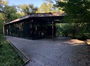 This image depicts the surrounding woods and exterior of the Ruth Lilly Visitors Pavilion at the Virginia B. Fairbanks Art &amp; Nature Park: 100 Acres on the Newfields campus in Indianapolis, Indiana, U.S.