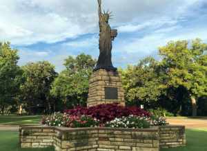 This is a scale model replica of the Statue of Liberty with pedestal and star shaped basin, about 20 feet tall, donated by the Boy Scouts of America (BSA) as part of the nationwide Strengthen the Arm of Liberty project of 1950, located in Oakdale
