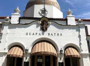 Front view of the Quapaw. Spanish style architecture with arched entry ways, an Indian motif, and a large tiled domed roof.
The Quapaw Bathhouse was originally built in 1922.
Keywords: Bathhouse Row; Quapaw Bathhouse; Historic building