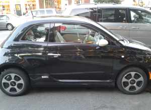 Electric Fiat 500e parked on Main Street in Hanover, New Hampshire.