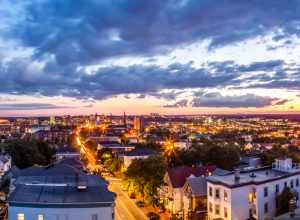 This is a five image panorama of images taken earlier this evening from the Portland Observatory.  On the left is the harbor and on the right  Back Cove.  The latter is a shallow basin connected to the sea.

The Portland Observatory is a wooden,
