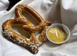 Pretzel with hot mustard at The Rathskeller, Indianapolis, Indiana.