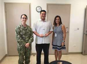(L-R) NAVFAC Pacific Vice Commander Capt. Michelle LaDuca presents Asset Management employee Jasen Hee (AM42) Feb. 26 with the Employee of the Quarter Award for the 4th Quarter of 2017. Vanessa Simpkins, Hee's supervisor, is also pictured in support