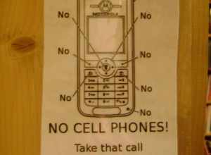 NO CELL PHONES! Take that call outside! Stop annoying people!

Myopic Books, Chicago, May 2009.