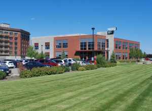 Photo of the Spokane Technology Center building in August 2013 under its Innovate Washington banner.  The building was developed in 2005 by the Spokane Intercollegiate Research &amp; Technology Institute (SIRTI), one of the predecessor agencies that