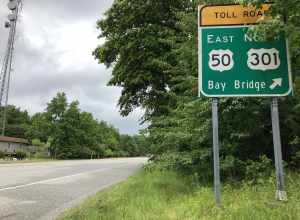 View east along Maryland State Route 908 (East College Parkway) just west of the exit for U.S. Route 50 EAST/U.S. Route 301 NORTH (Bay Bridge) in Skidmore, Anne Arundel County, Maryland