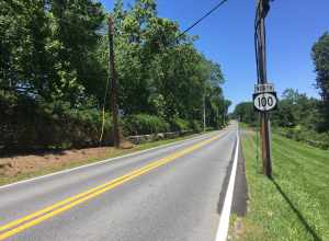 Northbound Delaware Route 100 (Montchanin Road) past the intersection with Kirk Road in Montchanin, Delaware