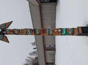 a modern totem pole in Anchorage, AK