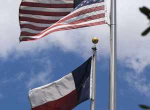 U.S. and Texas flags at the Butler Longhorn Museum Wild West Show in League City