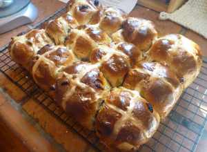 Hot Cross Buns on a wire rack.