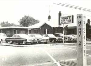 "Buddie's" Used Cars, intersection of Henry  and Church Streets, Rocky Mount, NC (http://digital.ncdcr.gov/u?/p249901coll22,66604)