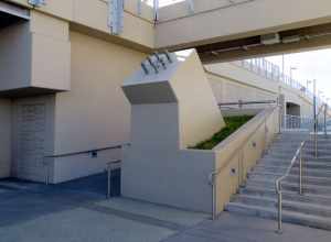 An angled pole base on the north side of San Bruno Avenue on the east side of San Bruno station in June 2018. Constructed with the station in 2014, it was intended for a gateway arch symbolically welcoming visitors to San Bruno that has not been