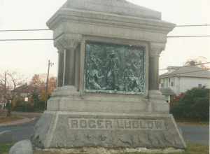 The Roger Ludlow Monument located in the traffic circle at the confluence of Gregory Boulevard and Marvin Street in East Norwalk, Connecticut. Ludlow was the founder of first European settlement in Norwalk. The work was dedicated in 1895.