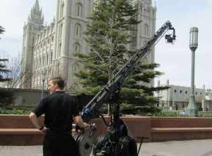 A cameraman waits on Temple Square to broadcast footage for the international broadcast of General Conference.