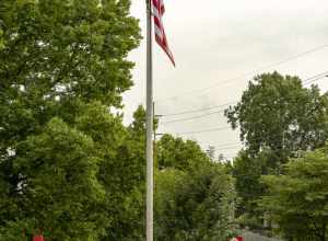 Two small statues at the Jackson Township fire department headquarters on a stormy day.